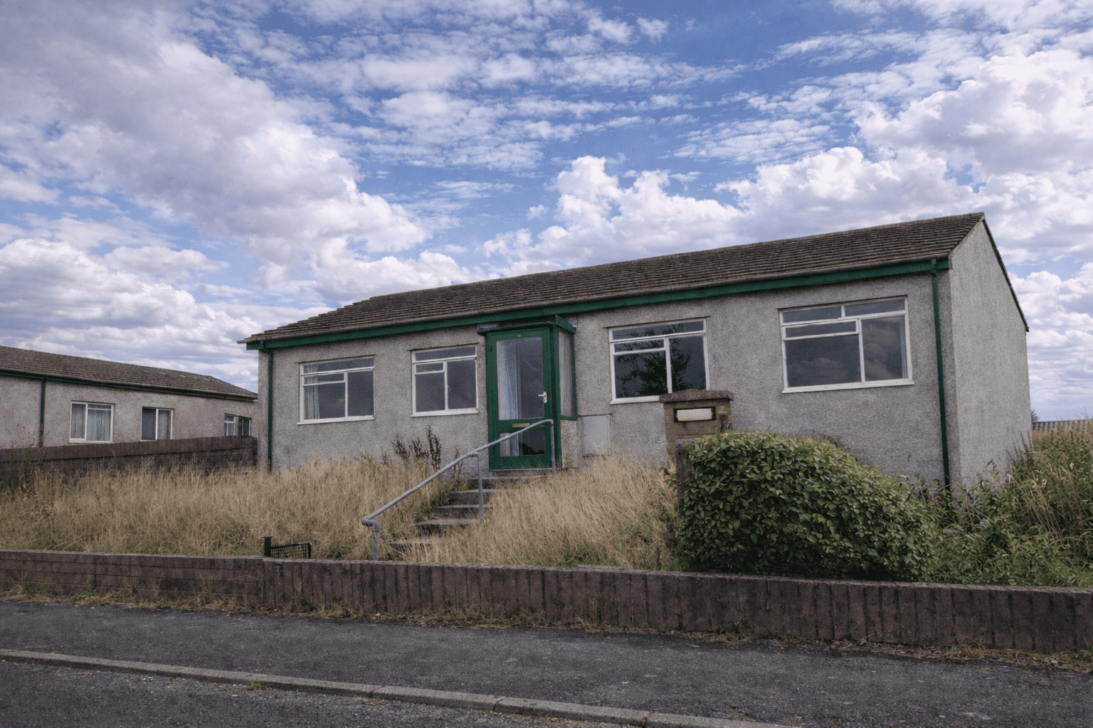 1960s Arcal system-built house with rendered walls and pitched tiled roof