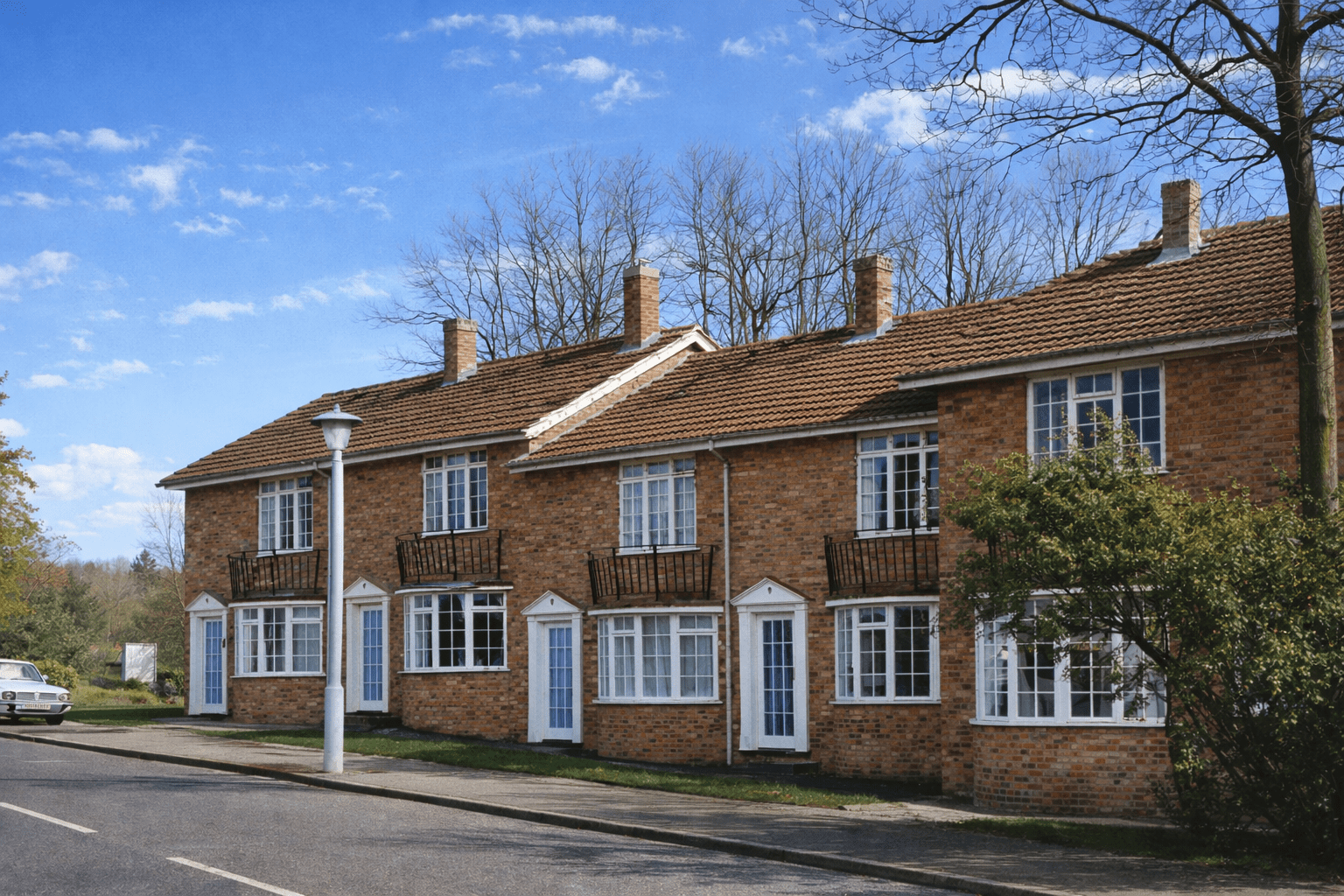 Arrowtrim house showing brick lower walls and tile hanging to upper storey